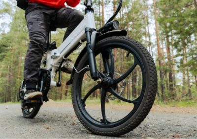 Rider on an e-bike on a wooded trail